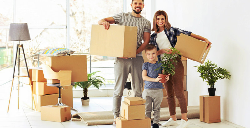 a family of three packing their items for a house move