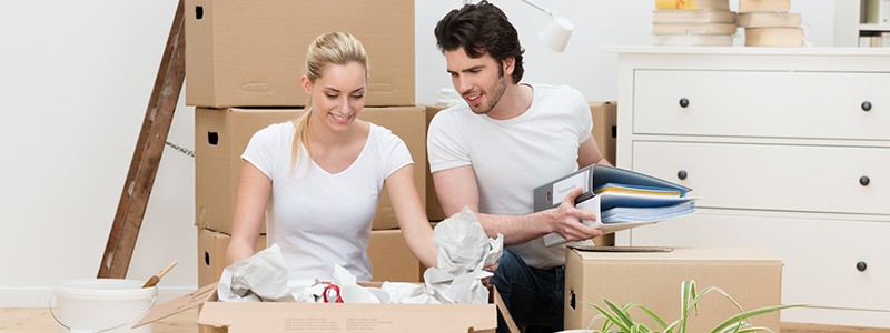 young couple packing up their household for relocation