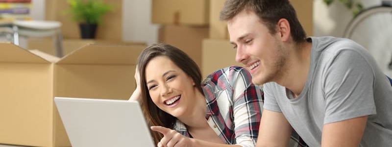 young happy couple preparing to relocate their house