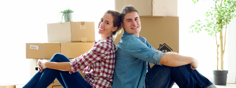 young couple sitting relaxed on the floor