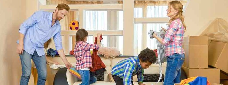 family unpacking their household in their new house