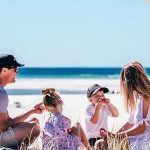 family enjoying at the beach side