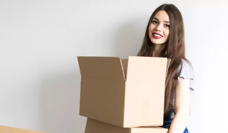 woman holding a cardboard box