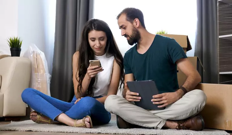 couple sitting on the floor discussing something