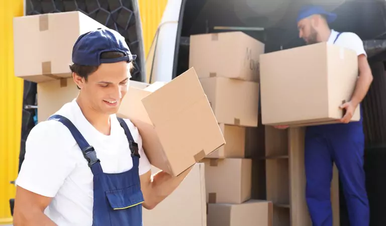 professionals loading a truck with some boxes