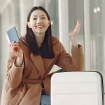 young woman with her passport during an international trip