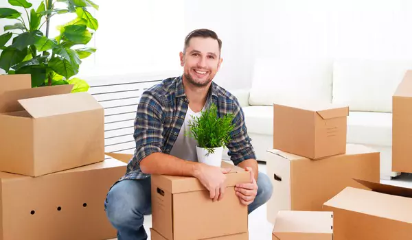 young man with some cardboard boxes