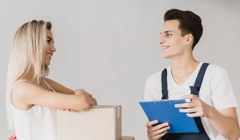 woman talking with a professional mover before a moving job