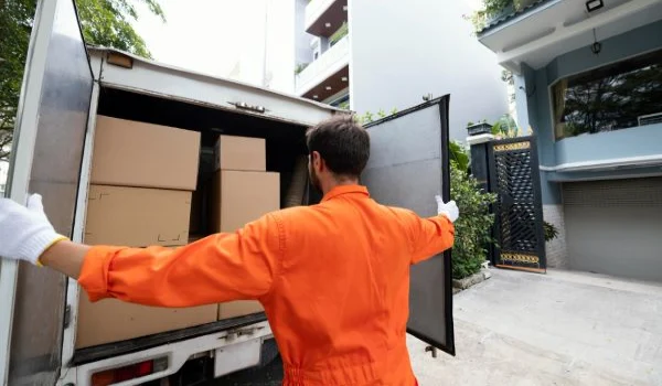 Young man closing truck doors